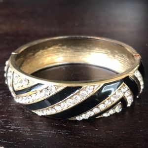 Gold and black bracelet with embellished diamonds